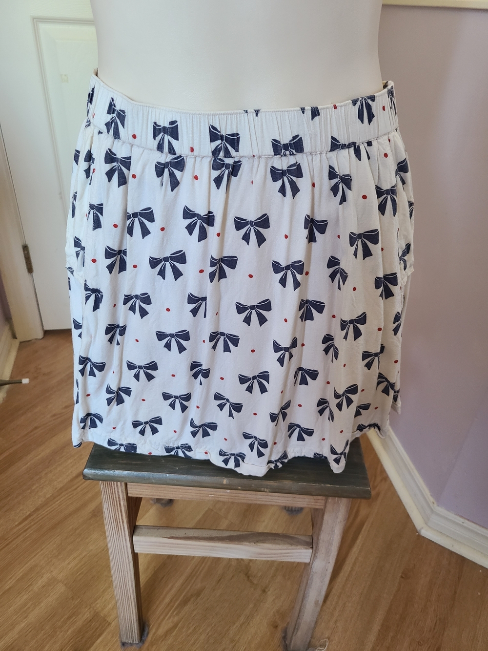 Cooperative White Mini Skirt with Navy Bow & Red Dot Accents